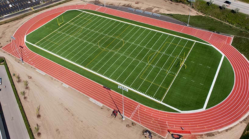 birds' eye view of football field with artificial sports turf